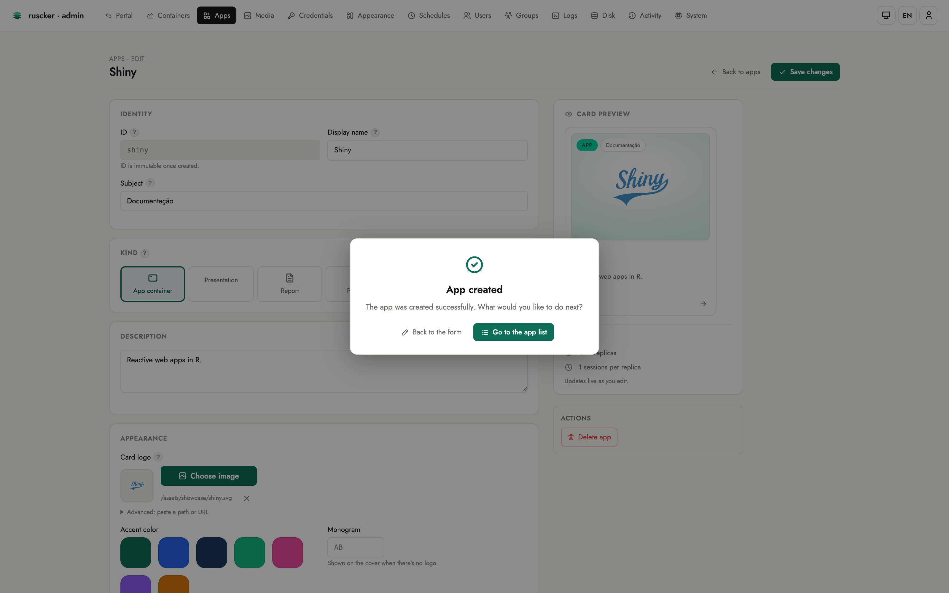 The post-create confirmation: a centred “App created” dialog reading “The app was created successfully. What would you like to do next?” with “Back to the form” and “Go to the app list” buttons over the dimmed editor.